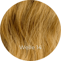Karamellblonde Extensions gewellt