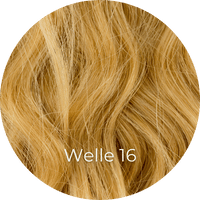 Dunkelgoldblonde Extensions gewellt